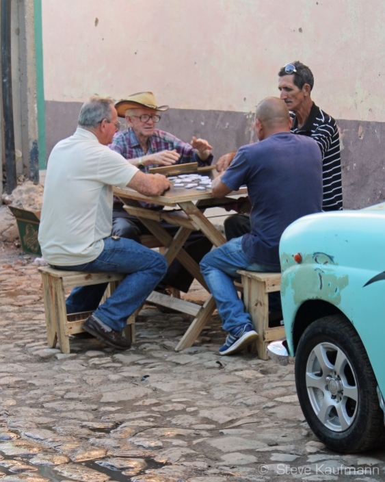 A game of street dominoes. Trinidad, Cuba